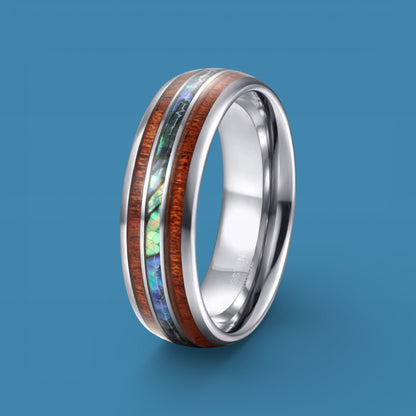 1ct Tungsten ring with wooden and abalone shell inlay on a blue background